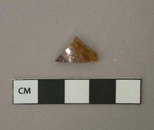 Mottled brown lead glazed earthenware vessel body fragment, buff paste, likely Rockingham type