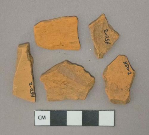 Undecorated unglazed redware vessel body fragments