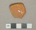 Tan lead glazed redware vessel body fragment