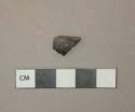 Black lead glazed earthenware body fragment, reddish gray paste, likely Jackfield type