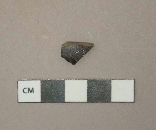 Black lead glazed earthenware body fragment, reddish gray paste, likely Jackfield type