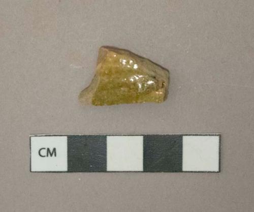 Greenish tan and brown lead glazed redware vessel body fragment