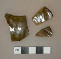 Greenish brown lead glazed redware vessel body fragments