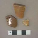 Brown salt-glazed stoneware vessel body and rim fragments, gray paste