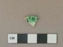 Green on white shell-edged pearlware vessel rim fragment, white paste