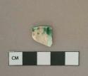 Green shell-edged pearlware vessel rim fragment, white paste