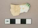 Green on white shell-edged pearlware vessel rim fragment, white paste