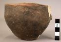 Cup (mended and restored) Dark, burnished ware. Approx. 11 cm diameter