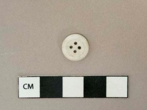 Intact white glass 4-hole button