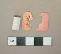 Plastic fragments, 2 pink bread clip fragments; 1 white ribbed tube, possibly cap