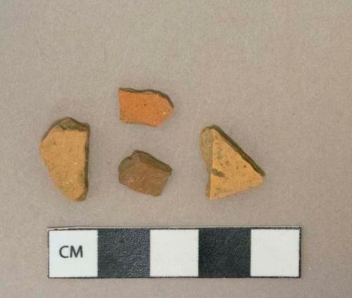 Unglazed undecorated redware vessel body fragments