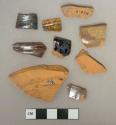 Brown lead glazed redware vessel body and rim fragments