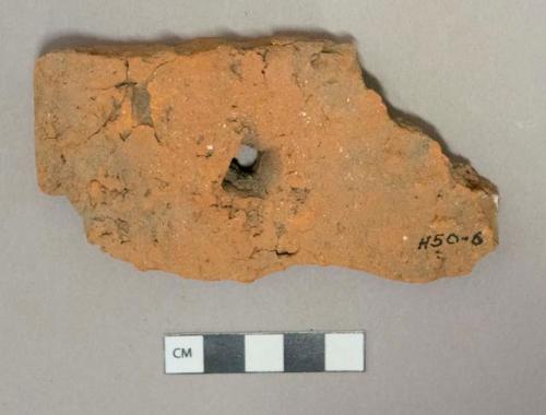 Red ceramic rooftile fragment, nail hole, visible temper