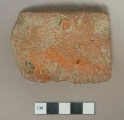 Red brick fragment, likely burned