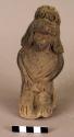 Ceramic figurine, seated humen, engraved and incised, rattle