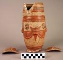 Cermic jar, red and brown on white, painted human face, moulded features, animal