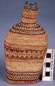 Basketry bottle cover; technique--twined; design of plain and zigzag horizontal