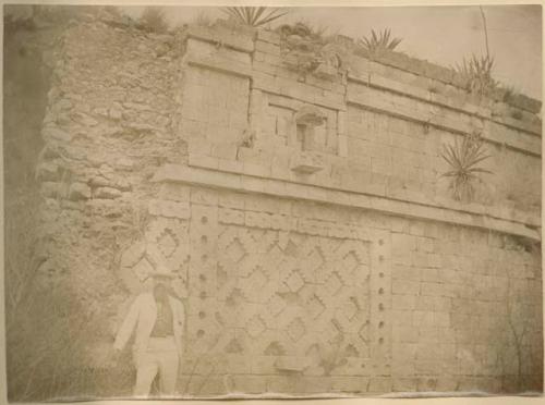 Man, possibly Augustus Le Plongeon, standing next to the Governor's Palace