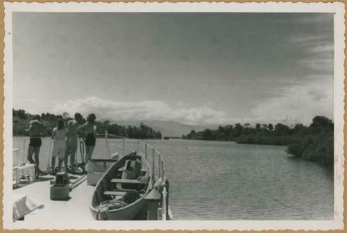 Chiriquí Lagoon, four people standing on bow or stern of boat