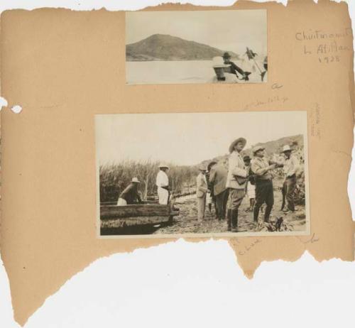 People and boats on shoreline of Lake Atitlan