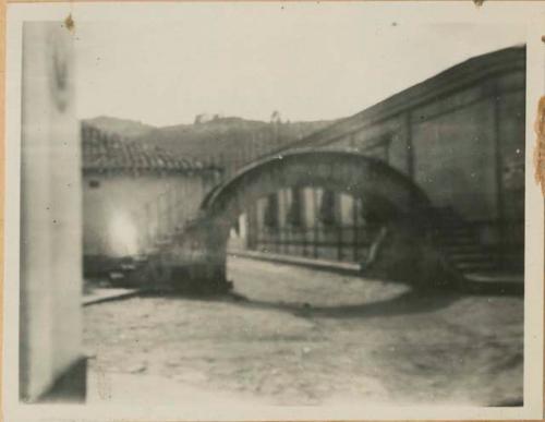 An arched bridge in a street