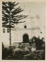 Church building with a small garden in front