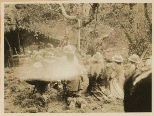 People kneeling in an open area