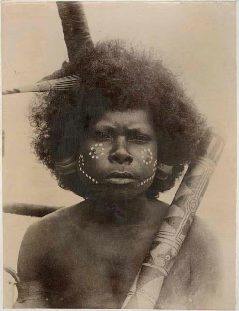 Studio portrait of a person with face paint