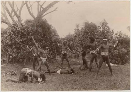 Group of men fighting with spears