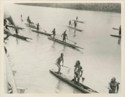 Men in canoes