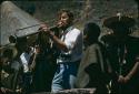 Ian Graham blowing a trumpet during Carnaval