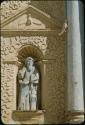 Carved stone statue façade detail in church of Santo Domingo