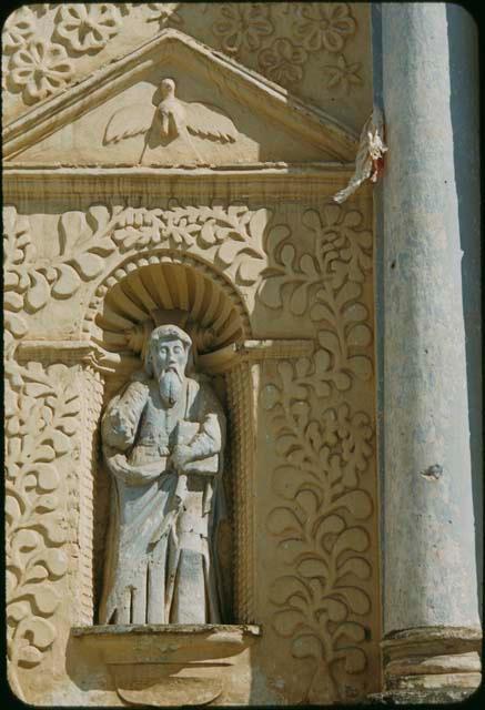 Carved stone statue façade detail in church of Santo Domingo