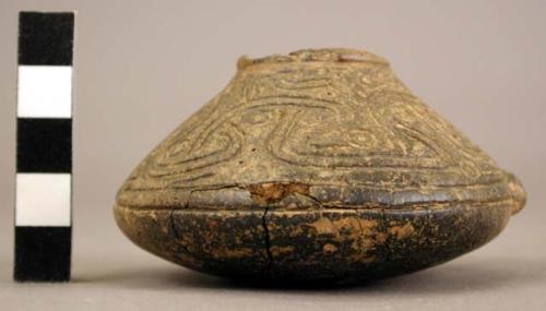 Small incised vessel with molded nubbin.