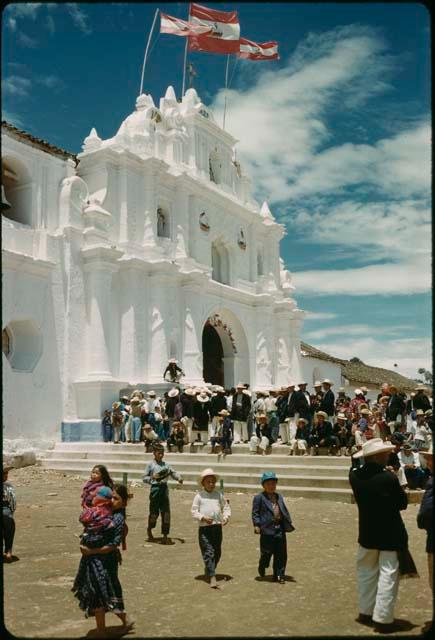 Church, flags, and crowd