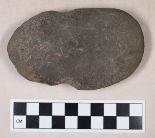 Ground stone, side-notched celt