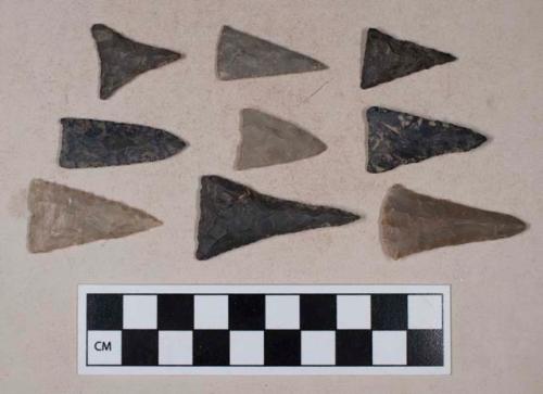 Chipped stone, straight base, triangular bifaces, some are possible perforators