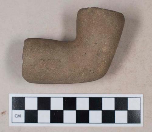 Ground stone, elbow pipe fragment