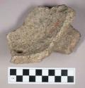 Ground stone, perforated steatite bowl fragment with partial handle