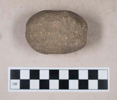 Ground stone, vertically and horizontally grooved, possible weight