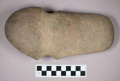 Ground stone, grooved axe with rounded end