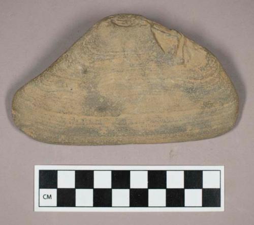 Ground stone, wedge with finger pits, possible scraper