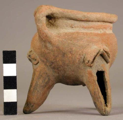 Pottery dish, tripod, legs hollow with clay balls