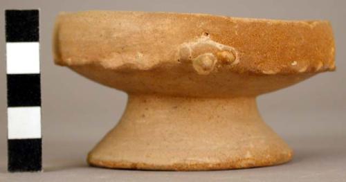 Small pottery bowl with pedestal base