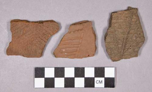 Ceramic, earthenware body and rim sherds, incised, incised crosshatch, dentate, and impressed; includes grit-tempered sherds