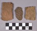 Ceramic, earthenware body sherds, impressed, dentate, and incised; one perforated sherd