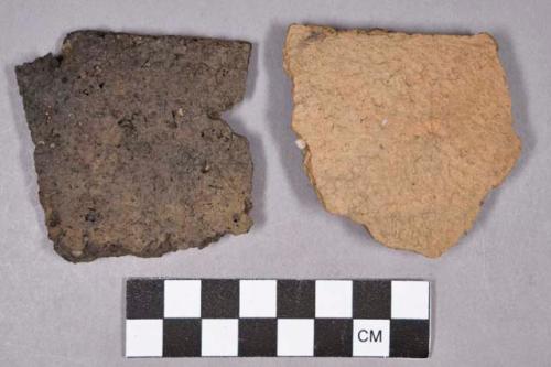 Ceramic, earthenware rim and body sherds, undecorated and impressed, grit-tempered; one perforated sherd; possible red ochre stain on sherd