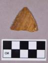 Chipped stone, projectile point, triangular with serrated blade