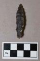 Chipped stone, projectile point, stemmed, serrated blade