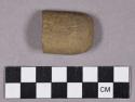 Ground stone, perforated stone fragment